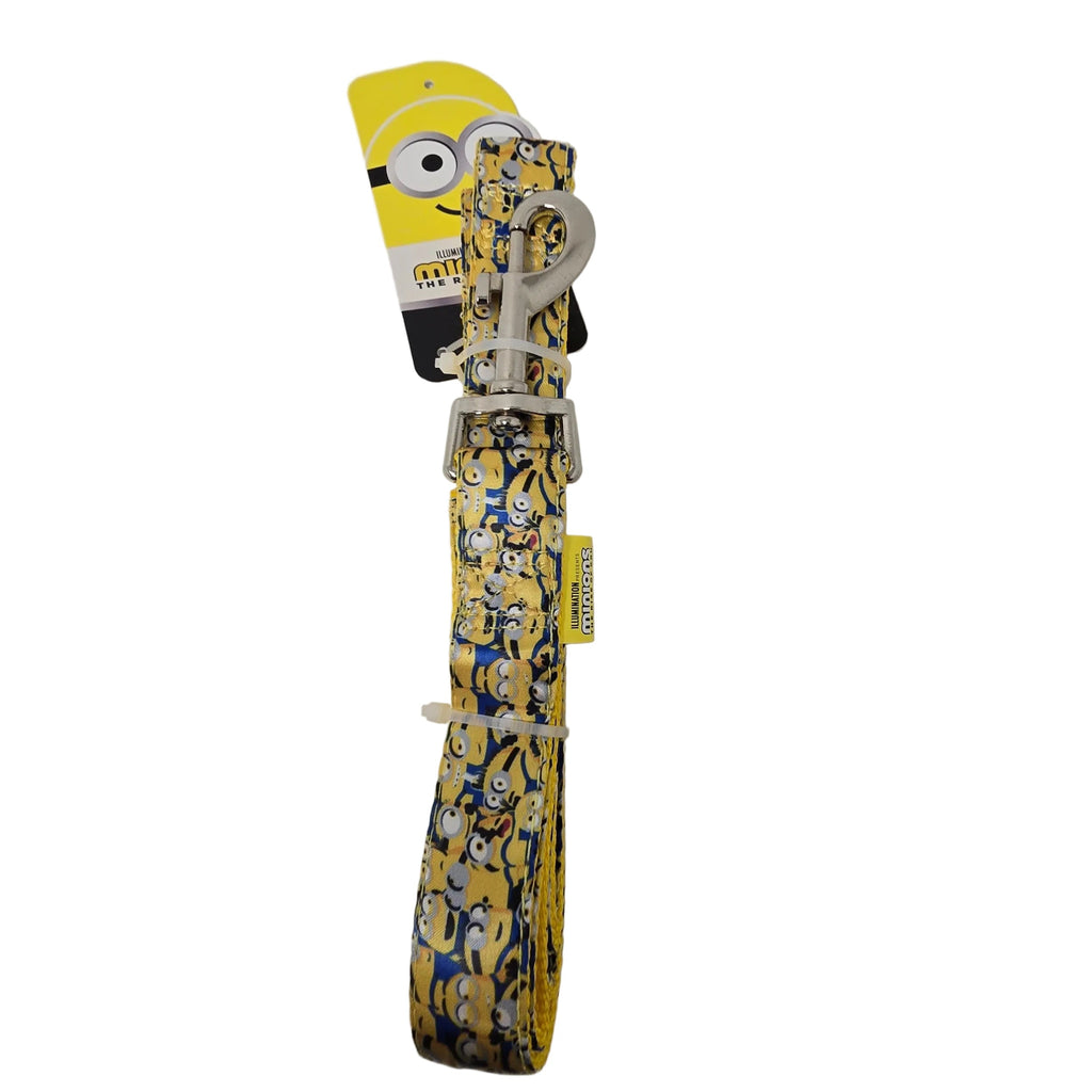 A yellow dog leash featuring a cartoon Minions character print, with a white plastic buckle and a yellow Minions-themed hang tag attached.