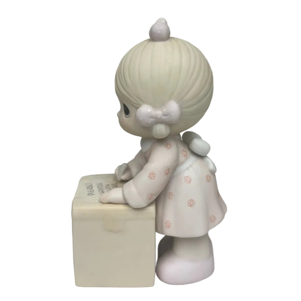 "Sharing is Universal" Precious Moments Figurine