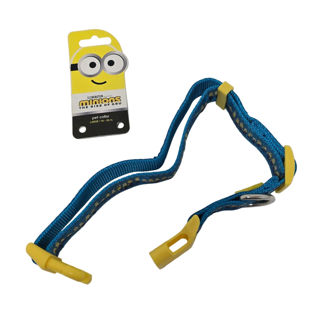 A blue dog harness with yellow plastic buckles and a yellow Minions-themed retail card, photographed on a plain white surface.